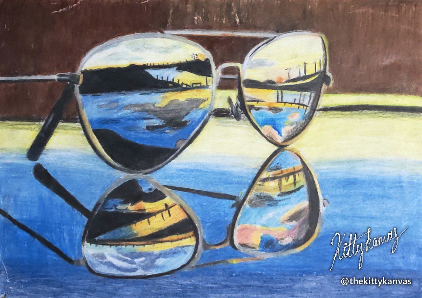 Coloured pencil drawing of aviator sunglasses on a table, their lenses reflecting a sunset beach and pier, with the glasses' own reflection on the blue table below